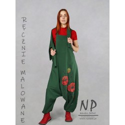 Green knitted dungarees decorated with hand-painted poppies