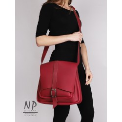 A large burgundy handbag made of natural leather handmade