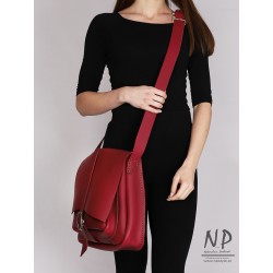 A large burgundy handbag made of natural leather handmade