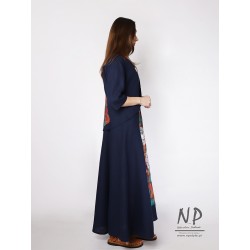 A long navy blue linen dress with straps complete with a linen jacket
