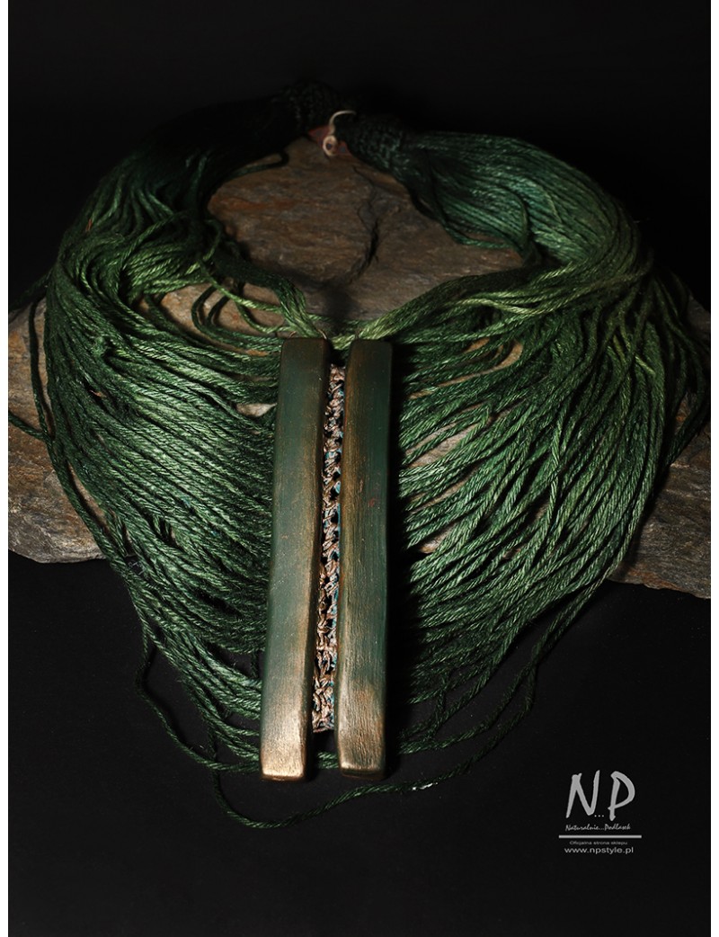 Handmade green necklace, made of linen and strings, decorated with ceramics
