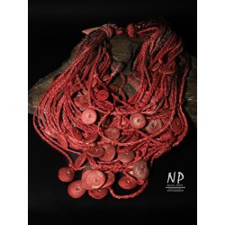 Large red necklace made of braided linen threads, decorated with ceramic beads