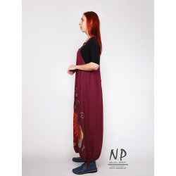 Long burgundy dungaree dress made of natural linen, decorated with hand-painted patterns