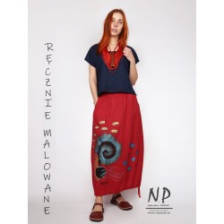 Red linen skirt decorated with hand-painted patterns, finished with a belt on an elastic band