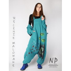 Turquoise Aladdin dungarees decorated with hand-painted patterns