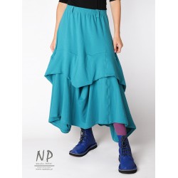 Long knitted skirt with elastic band and fastened layers of fabric