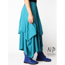 Long knitted skirt with elastic band and fastened layers of fabric