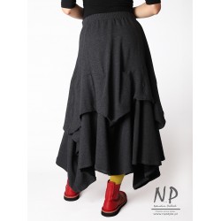 Knitted long gray skirt with elastic band and fastened layers of fabric