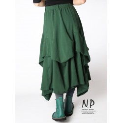 Knitted long green skirt with an elastic waistband and pinned-up layers of fabric