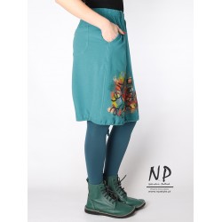 Knitted knee-length skirt decorated with hand-painted patterns