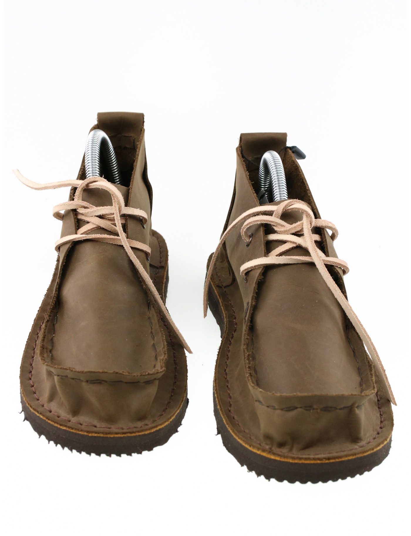 Brown moccasin shoes, sewn by hand.