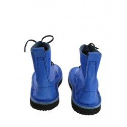 Hand-sewn higher leather shoes in blue, laced with a thong.